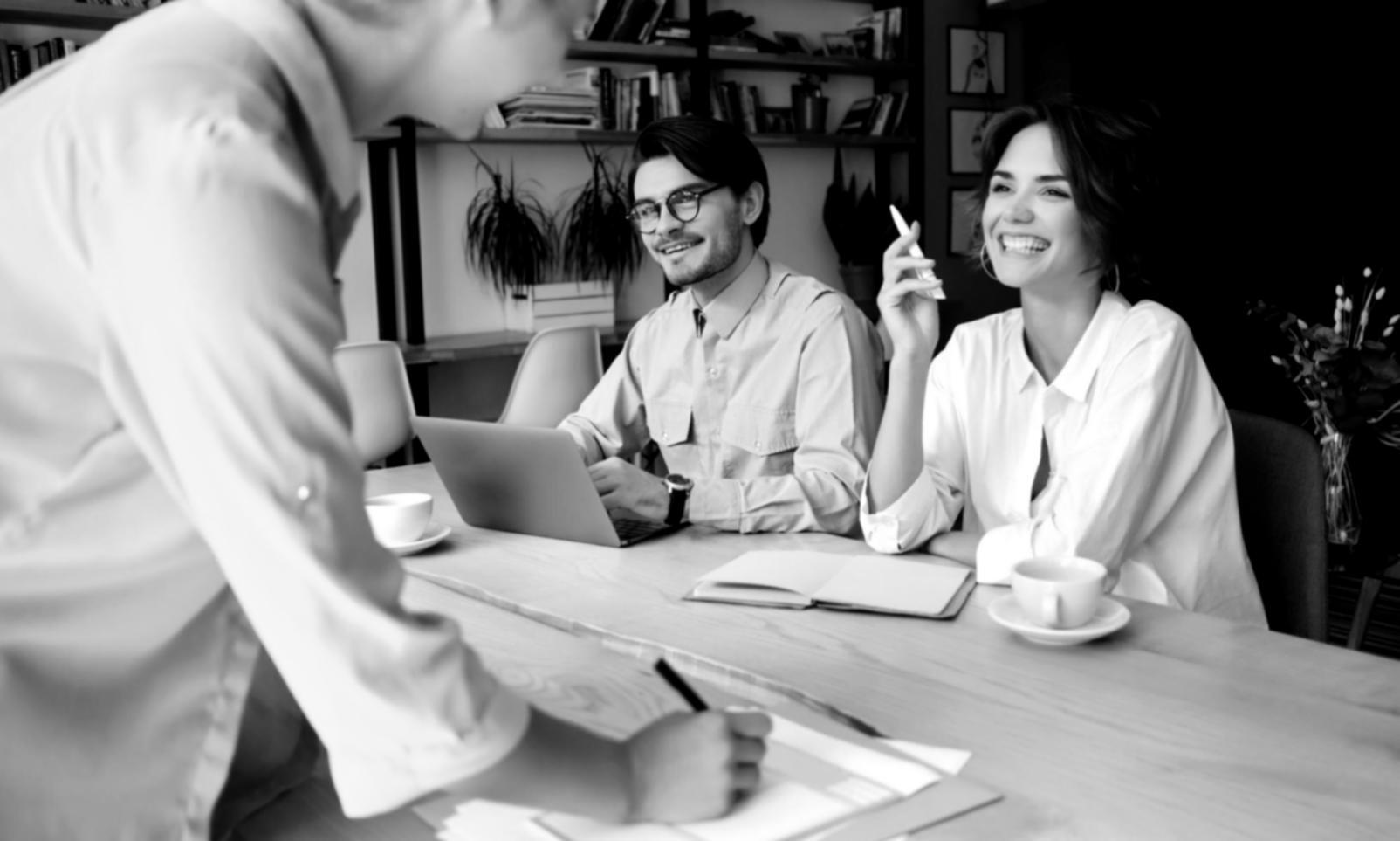 Modern workspace setup showing laptop with financial planning tools and educational materials